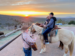 Guests enjoy%20the%20sunset%20on%20horseback%20at%20Grand%20Canyon%20Western%20Ranch